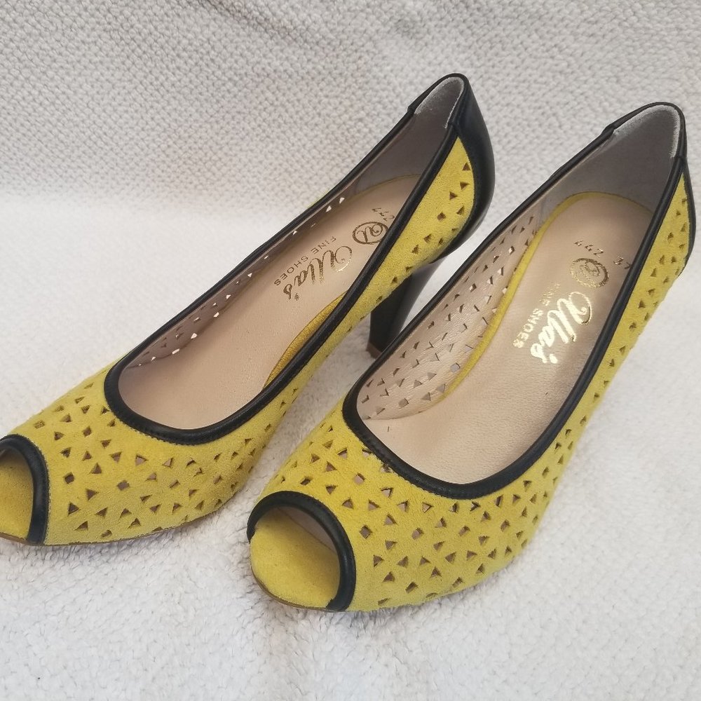 Nice pair of yellow suede perforated pumps for your closet!